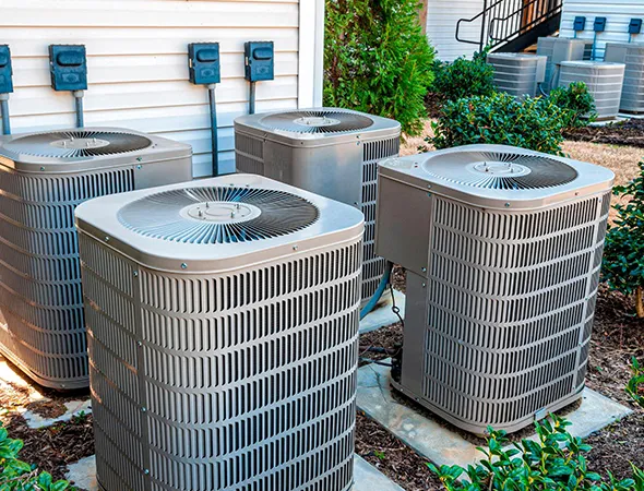Local Memphis HVAC installers setting up a new system for a residential home with modern equipment.