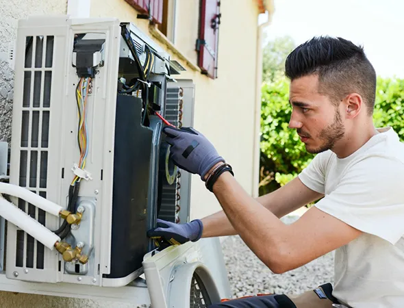 Trusted local heating technician fixing a broken heater in an Olive Branch, TN residence.