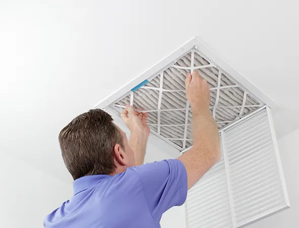 Certified technician cleaning HVAC ducts in Germantown, TN to remove dust and allergens from residential or commercial systems.