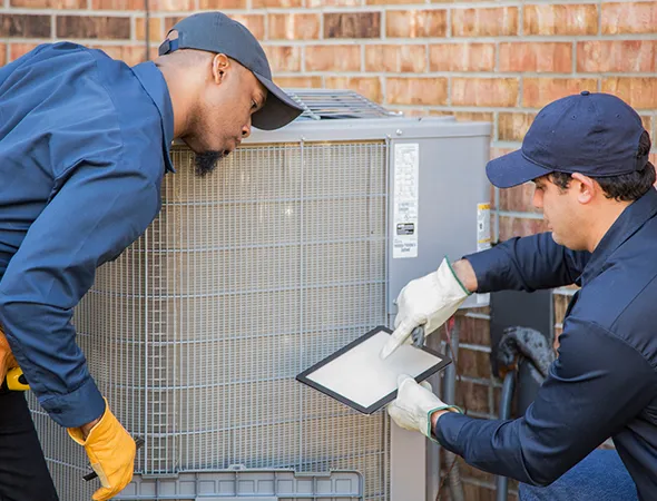 Emergency HVAC repair technician in Millington, TN using advanced tools for urgent system troubleshooting.